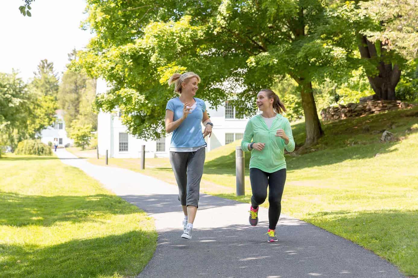 Two women in drug rehab jogging in front of Mountainside's women's sober house in CT