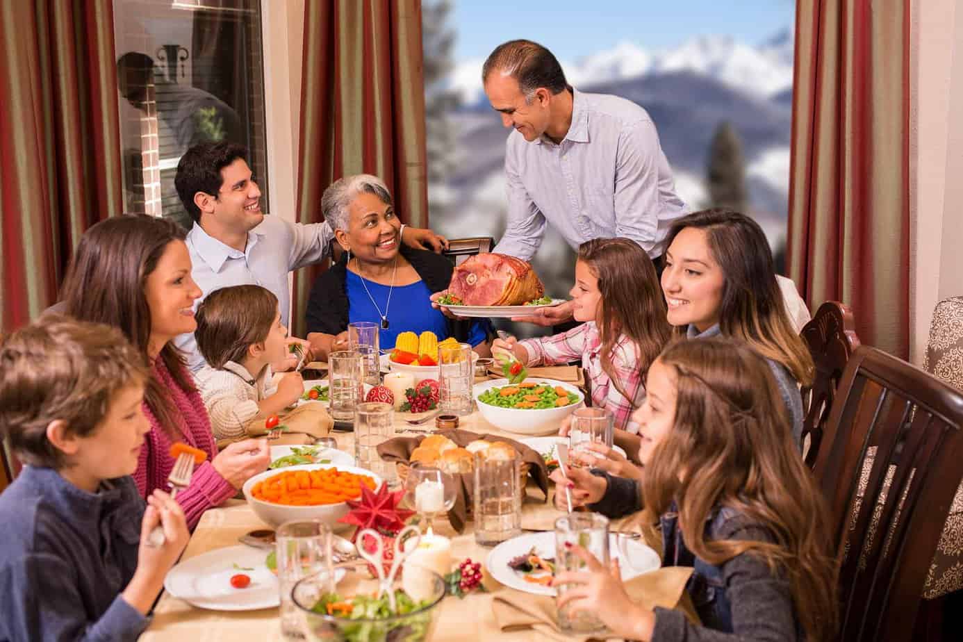 multi generational family enjoying holiday dinner