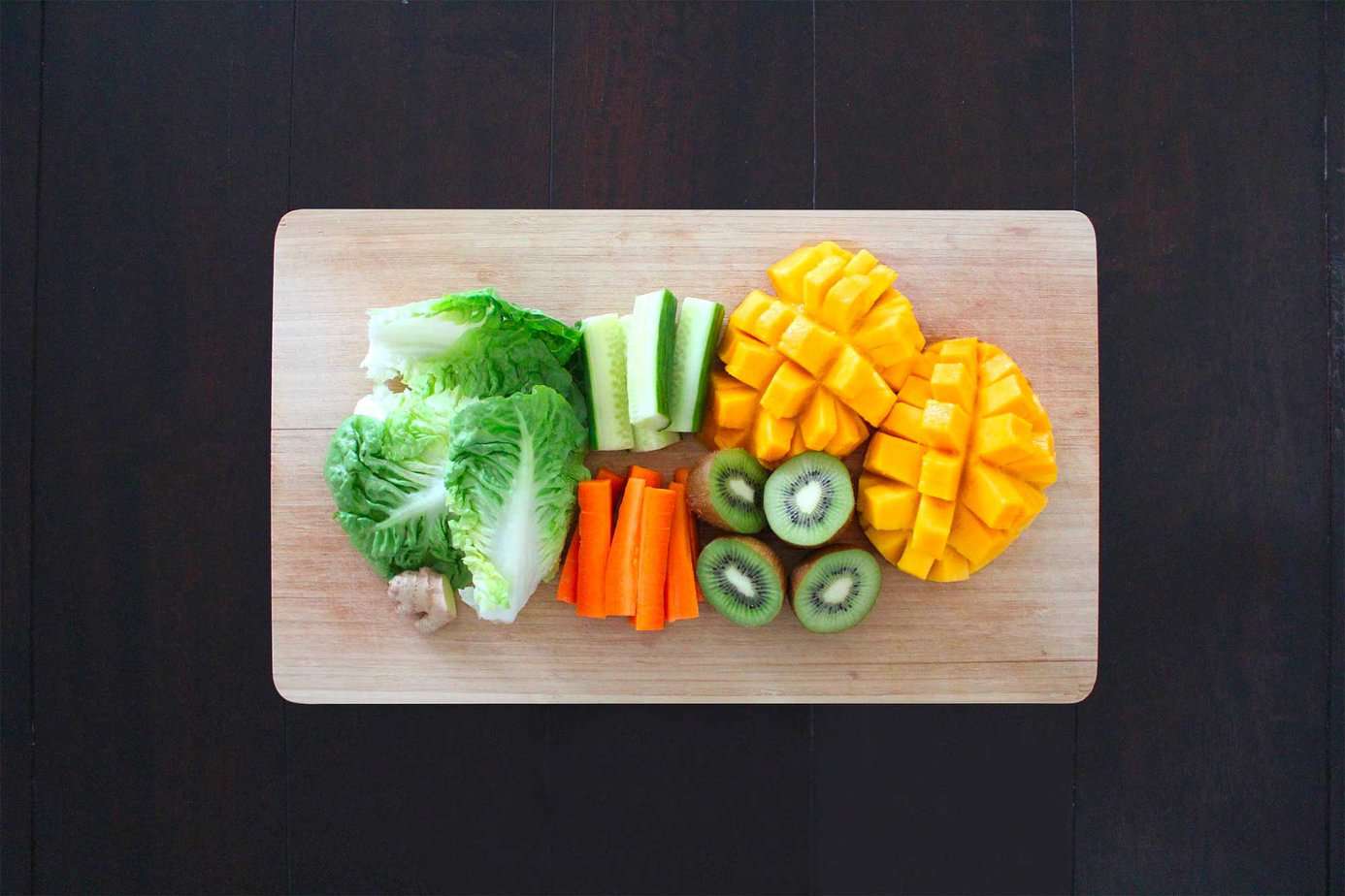 assortment of healthy foods arranged on a cutting board to promote better nutrition in recovery
