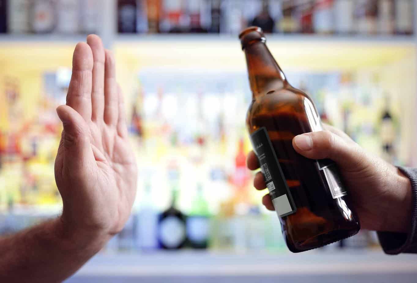putting up hand to refuse alcohol