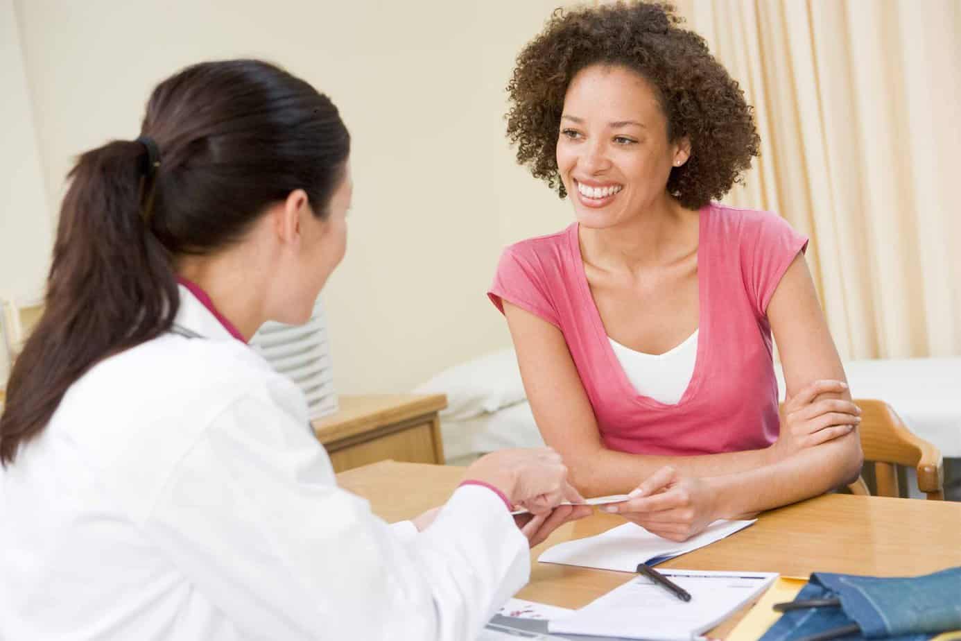 female client smiles at doctor