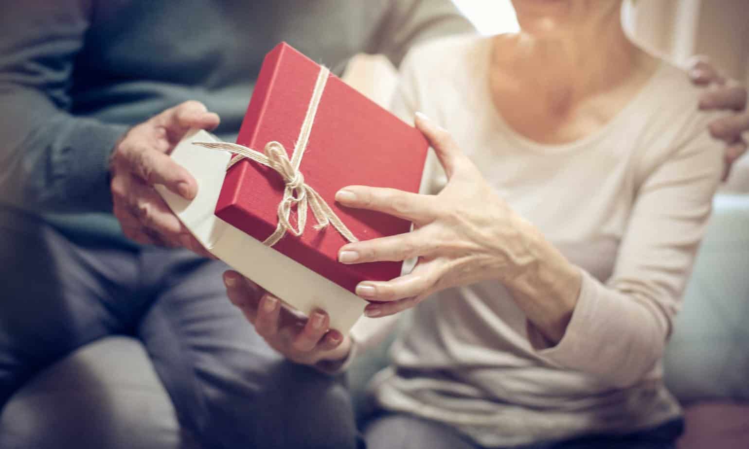 person in sobriety opening a present