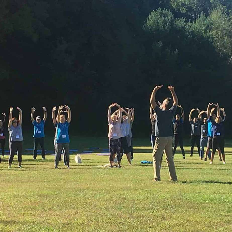 Group stretch at Mountainside Treatment Center Canaan Alumni Retreat Event 2018
