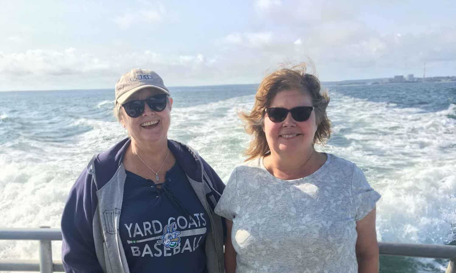 2 women on boat at Mountainside Treatment Center Alumni Fishing Event