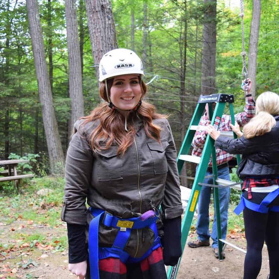 Woman in helmet at swing course at Mountainside Treatment Center Alumni Retreat 2017 in Canaan
