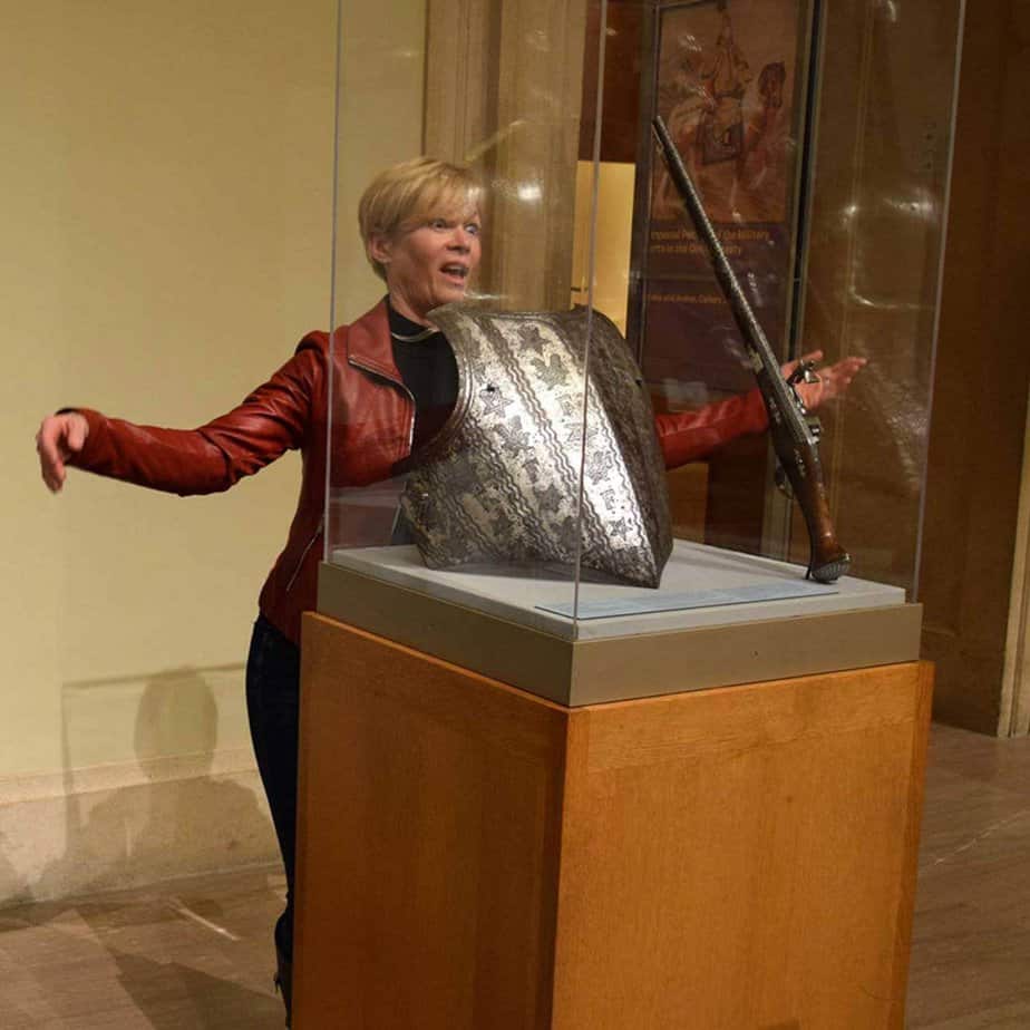 Woman by shield at Mountainside Treatment Center Alumni Met Museum Event in NYC