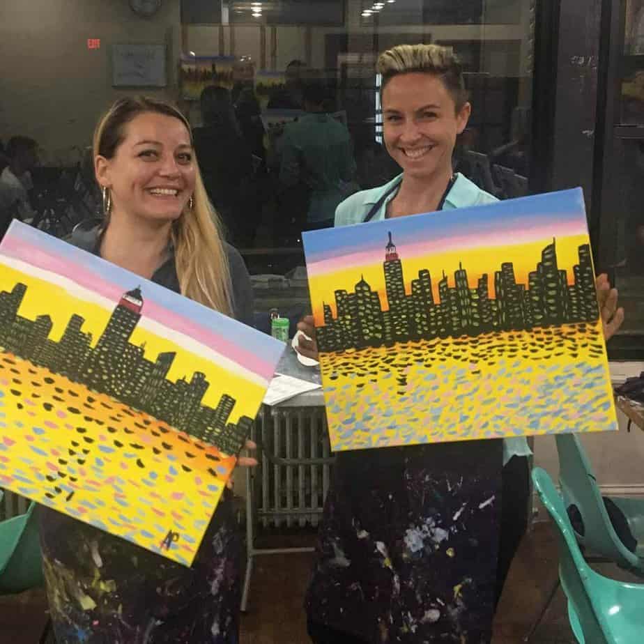 Alumni holding painting at Mountainside Treatment Center Alumni Paint Night Event in NYC