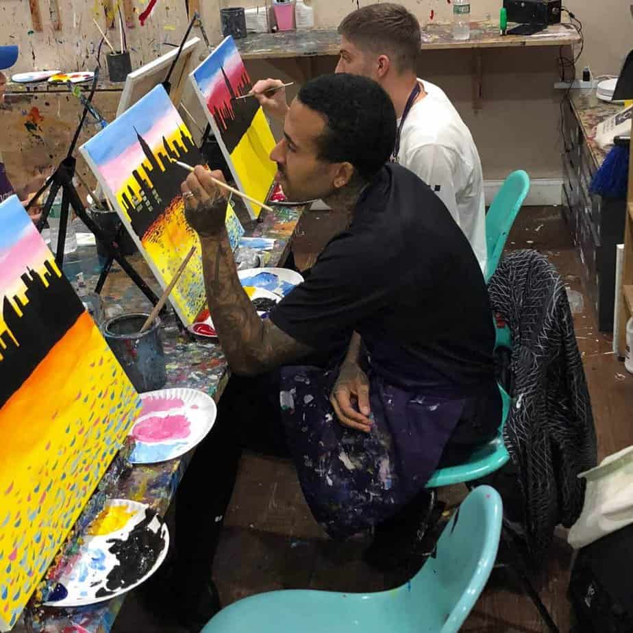 2 men painting at Mountainside Treatment Center Alumni Paint Night Event in NYC