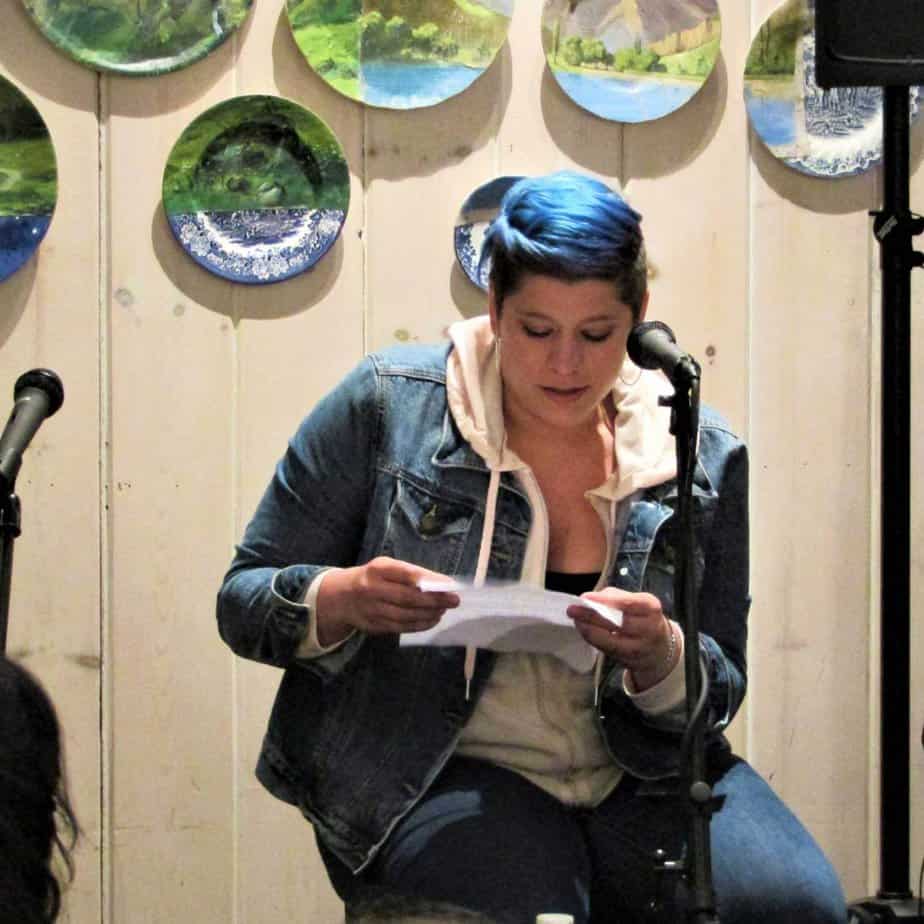 Woman reading on paper at Mountainside Treatment Center Open Mic Night April 2019