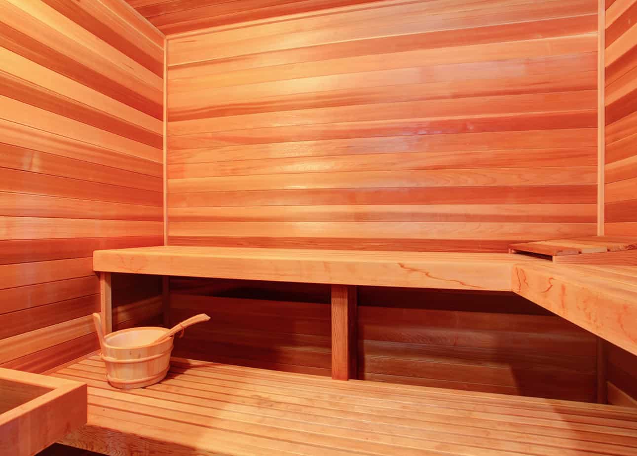 Sauna with benches and a beautiful wooden interior.