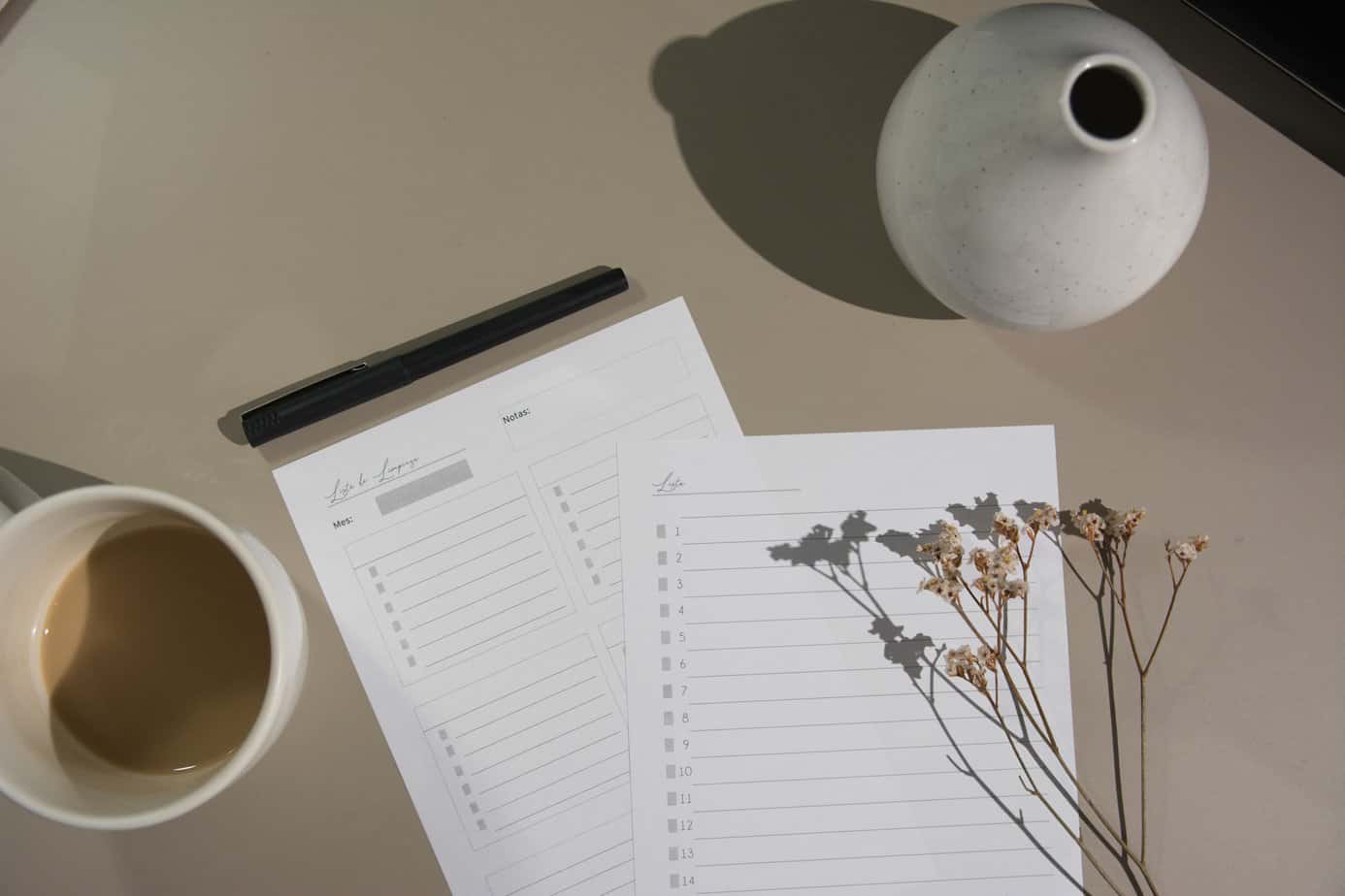Papers and lists on a table with a vase and flowers | Mountainside Addiction Treatment Center