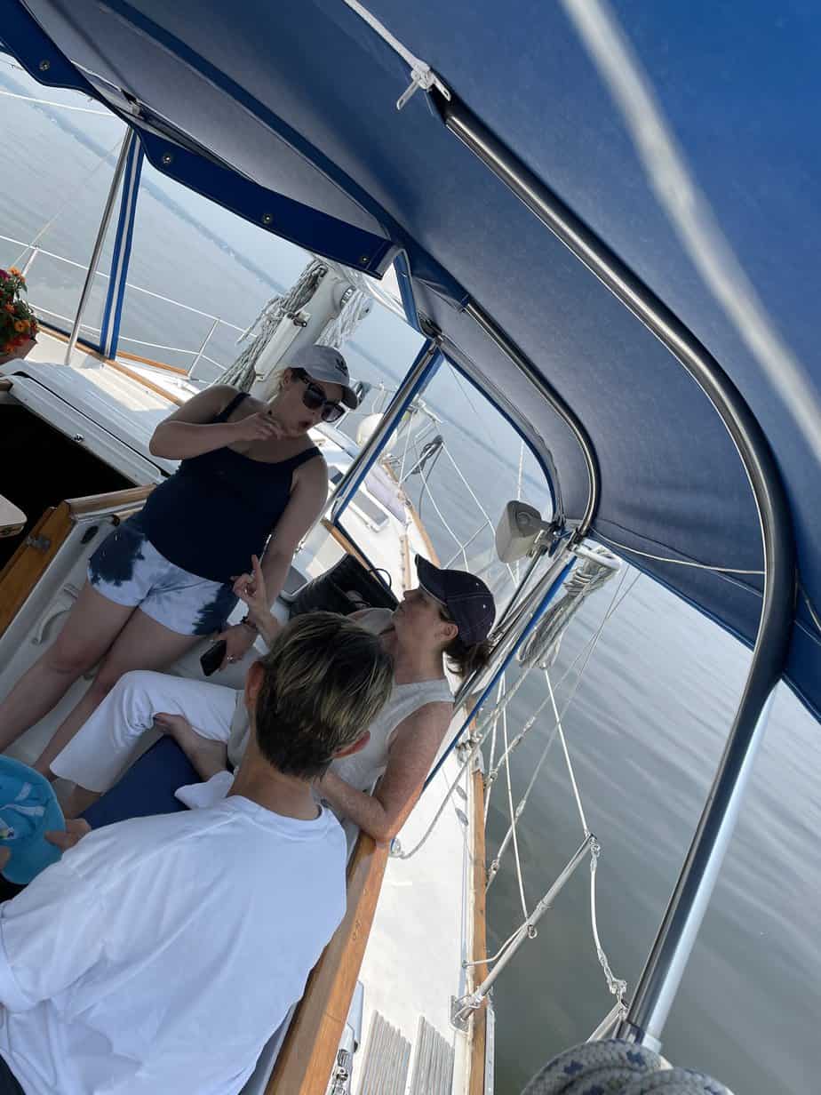 Group photo of women talking on boat at Mountainside Treatment Center Extended Care Sail & Dine Event Summer 2022