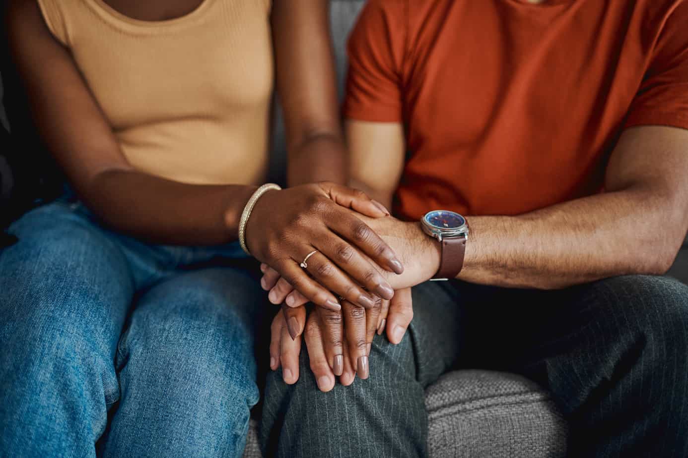 close-up of couple holding hands