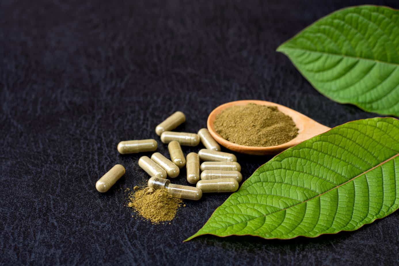 kratom in different forms, including powder, leaf, and capsule
