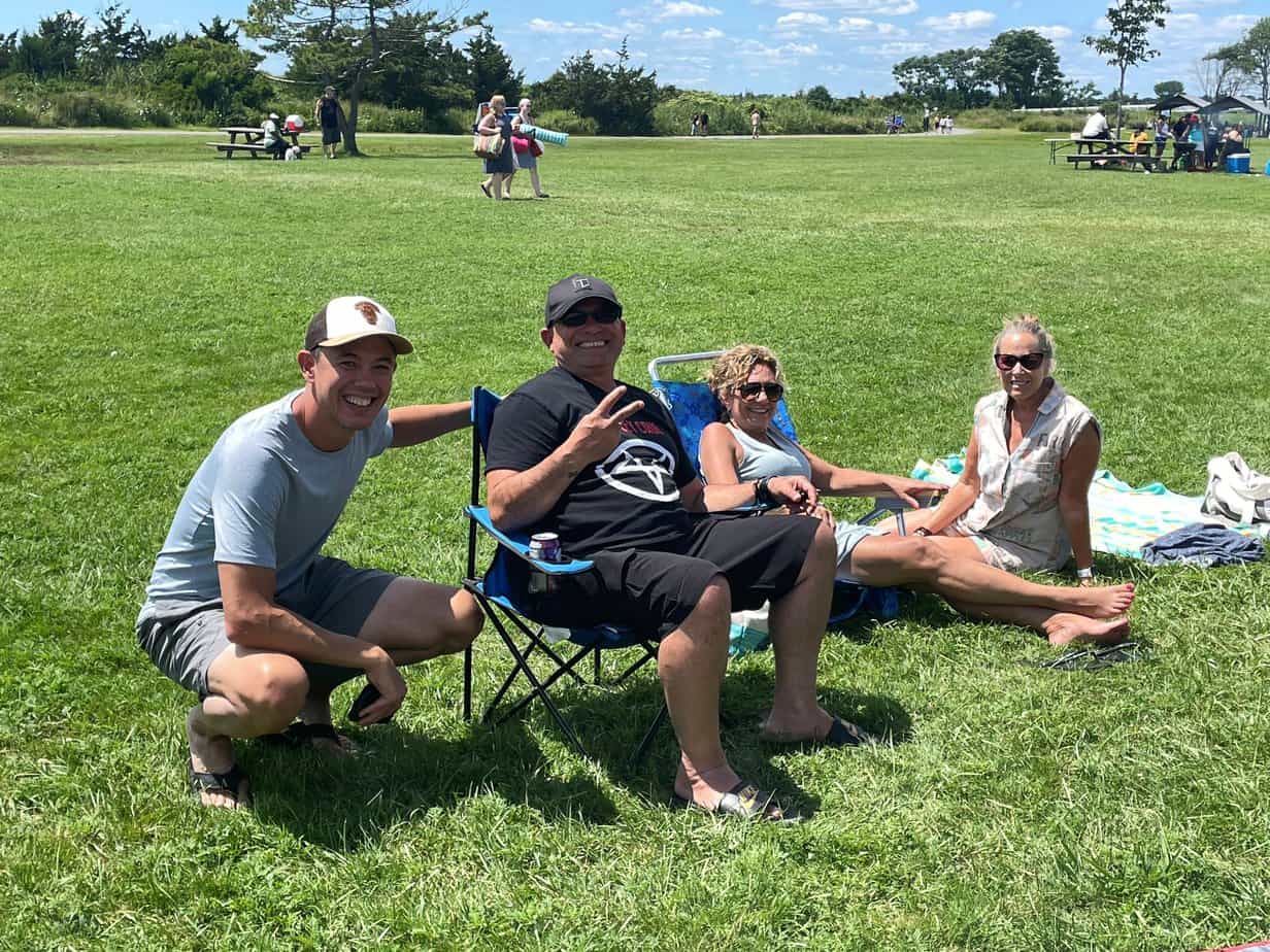 A group of Mountainside alumni enjoying a sunny day at a park in NY.