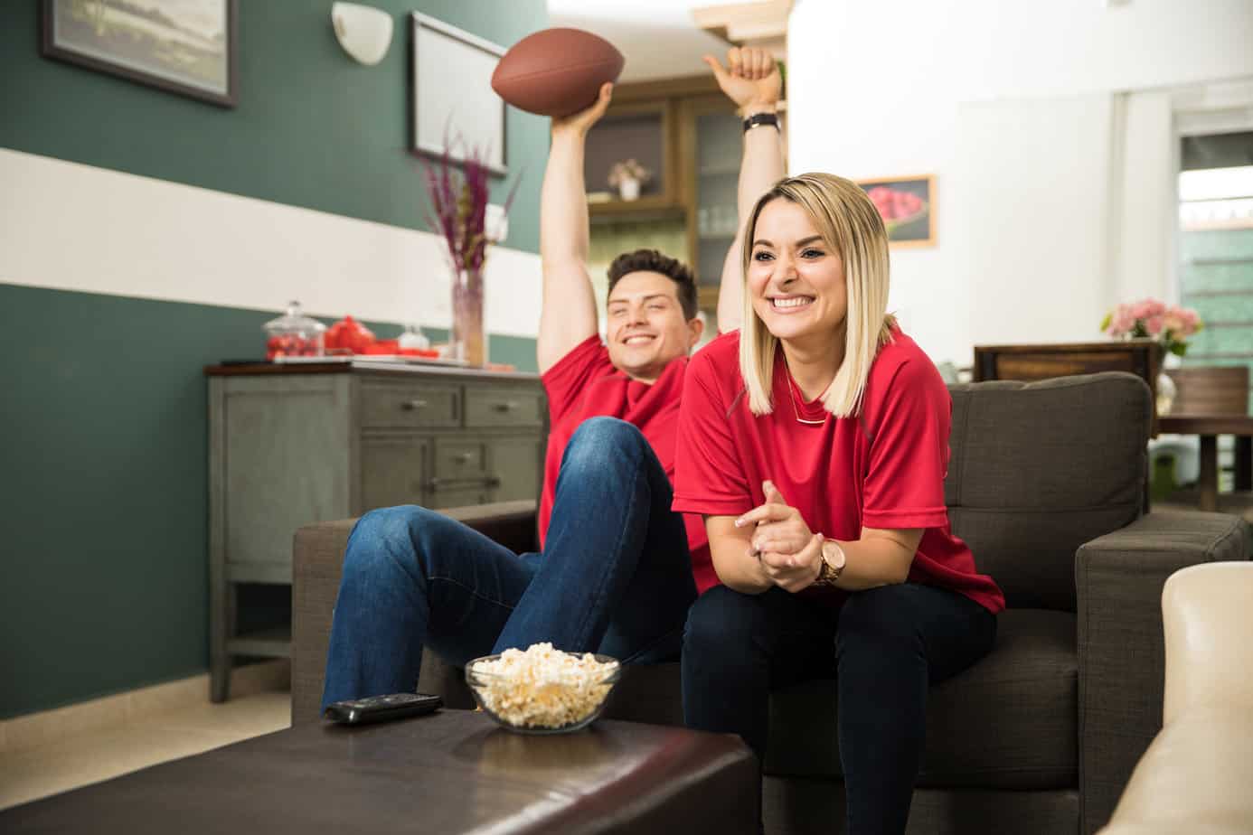 couple watching football on the tv
